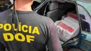 Policial, durante vistoria de veículo carregado de maconha - DOF/Divulgação