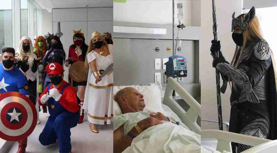 Pessoas fantasiadas de heróis em visita a hospital na Capital